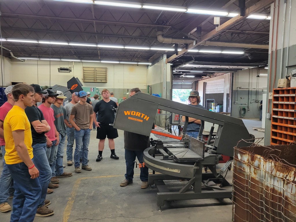 Students in welding are shown how to use the larger machines