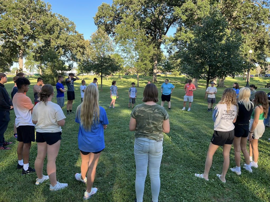 FBLA members stand in a circle for an icebreaker game