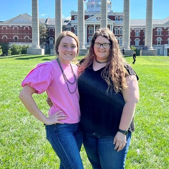 Two FFA members pose in front of the University of Missouri columns