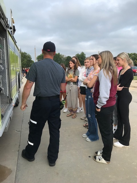 EMS personnel show the different equipment on the ambulance to Health Sciences students
