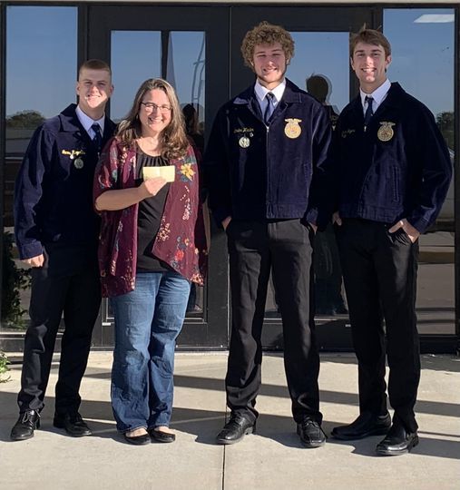 FFA members presenting a check to the local YMCA