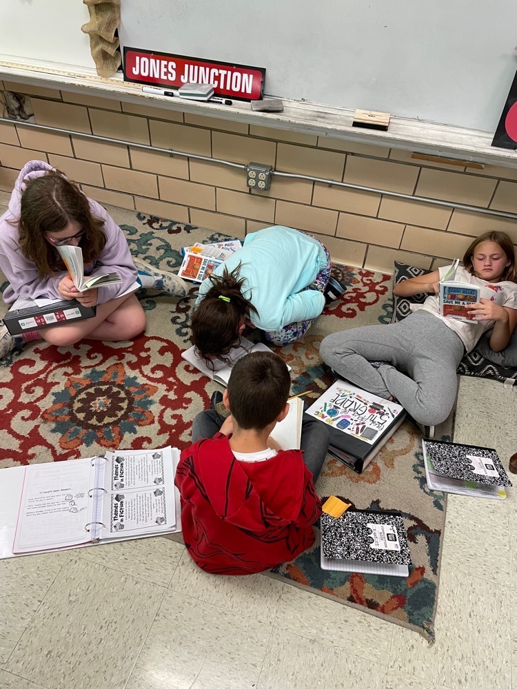 5th grade students reading in book clubs  