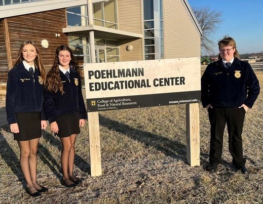 FFA members stand by Poehlmann Education Center sign at University of Missouri